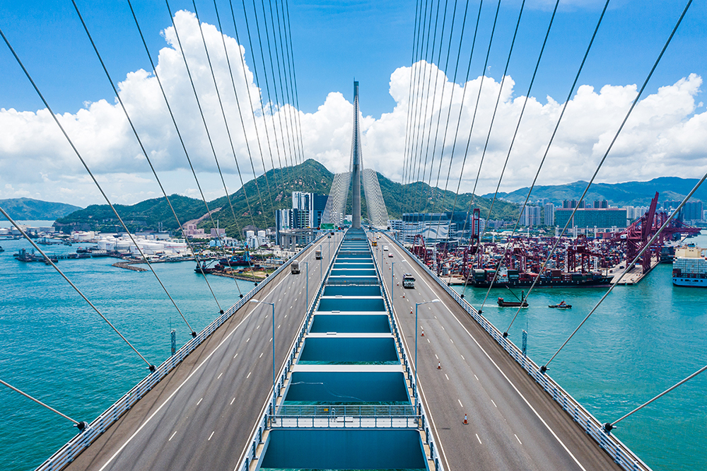 Bridge in Hong Kong and Container Cargo freight ship